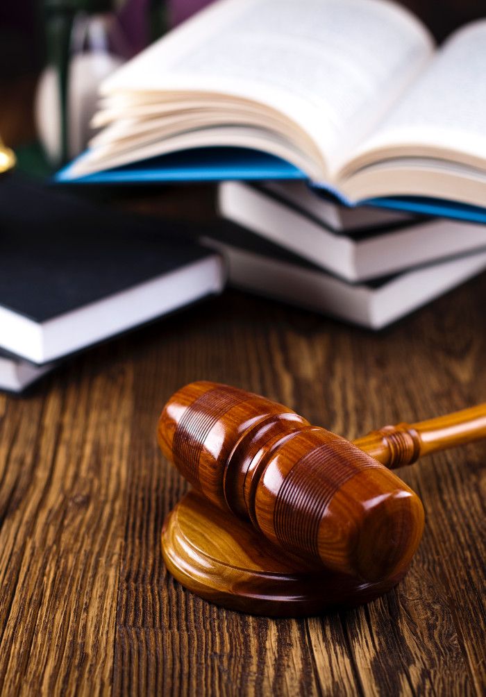 gavel with books in the background